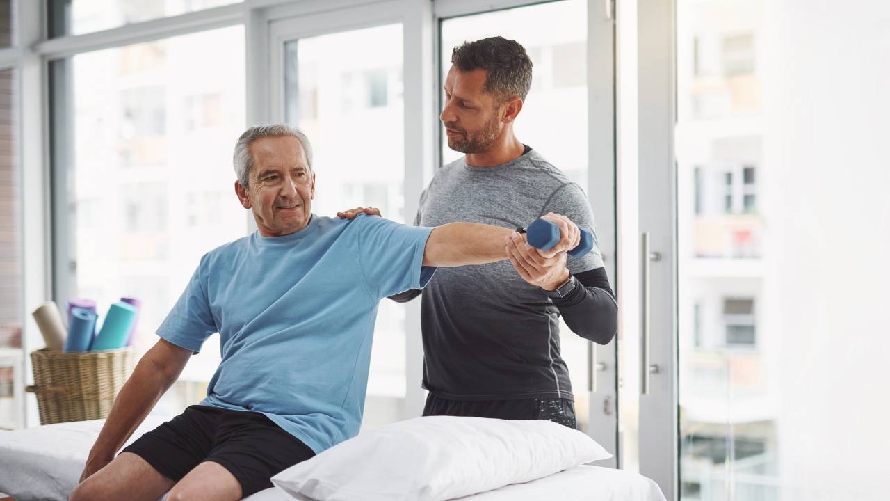 Physiotherapist conducting a homecare physio session with an elderly woman in an Australian home