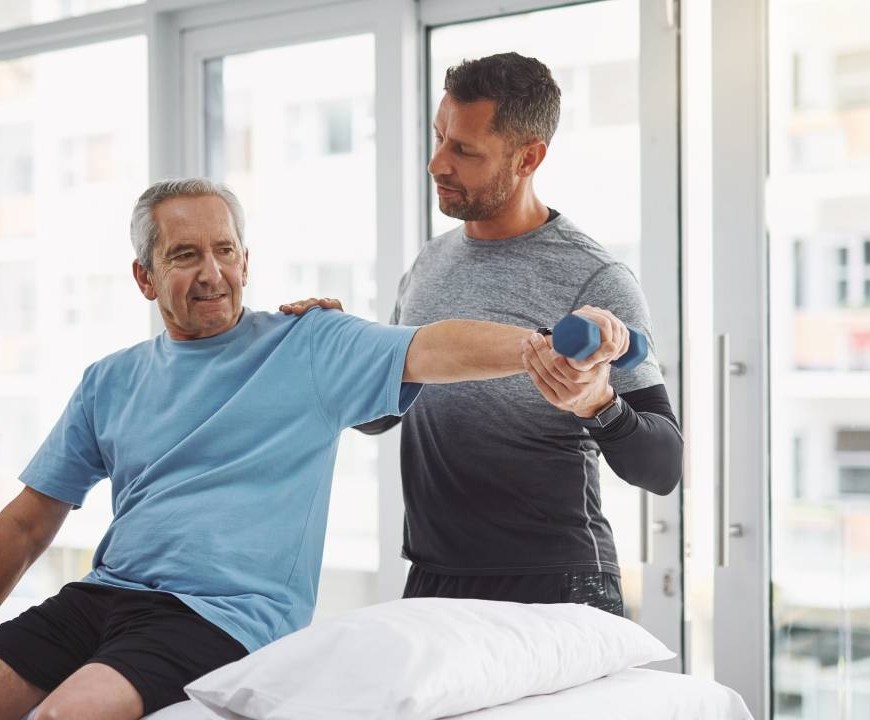 Physiotherapist conducting a homecare physio session with an elderly woman in an Australian home